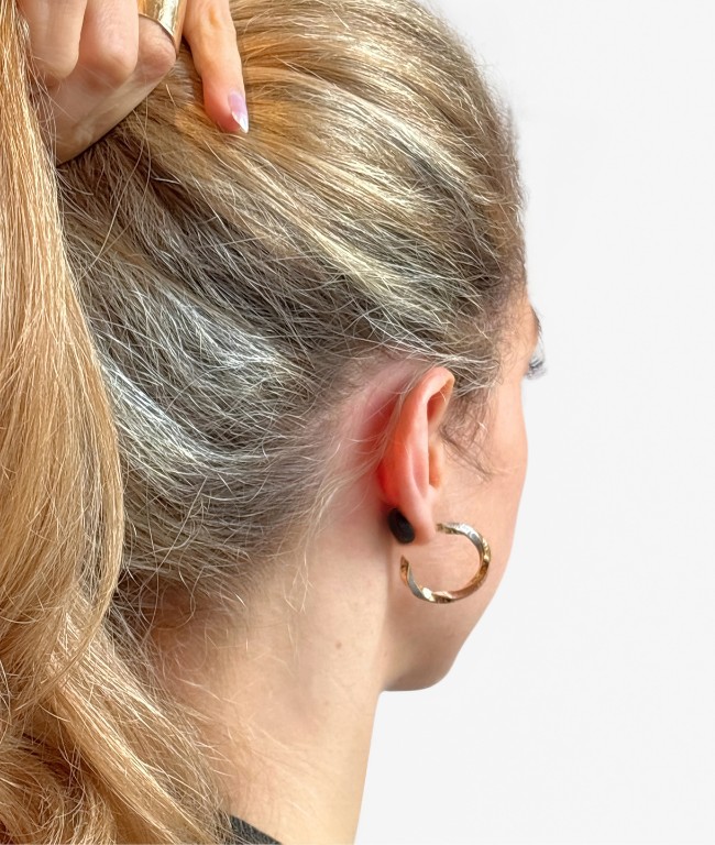 Phira wearable worn behind the ear